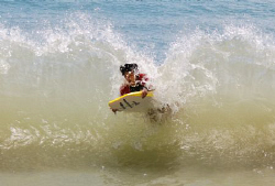 My son bodyboarding, gets hit by a wave returning from sh... by Helen Brierley 